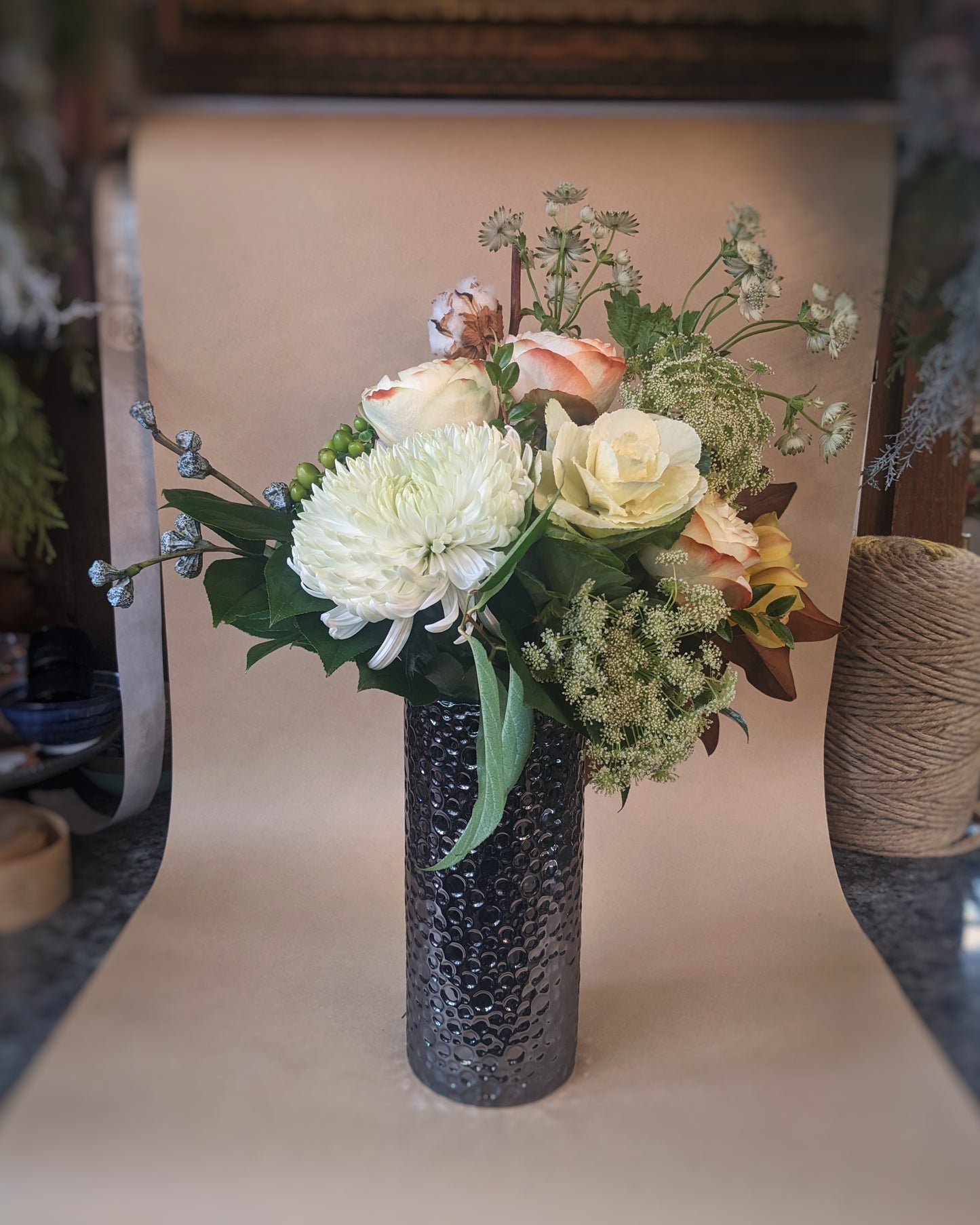 Arrangement in a Hammered Silver Cylinder