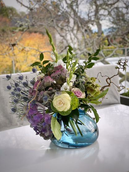 A Seasonal Display in Big Blue Rock Glass Vase Arrangement