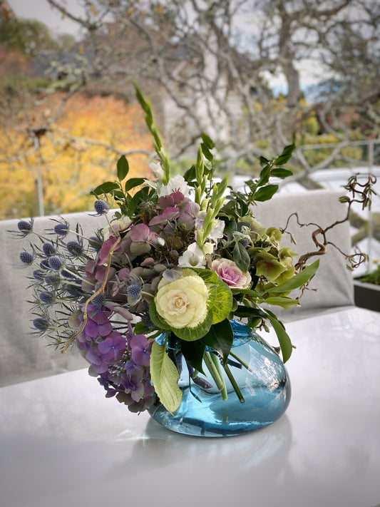 A Seasonal Display in Big Blue Rock Glass Vase Arrangement