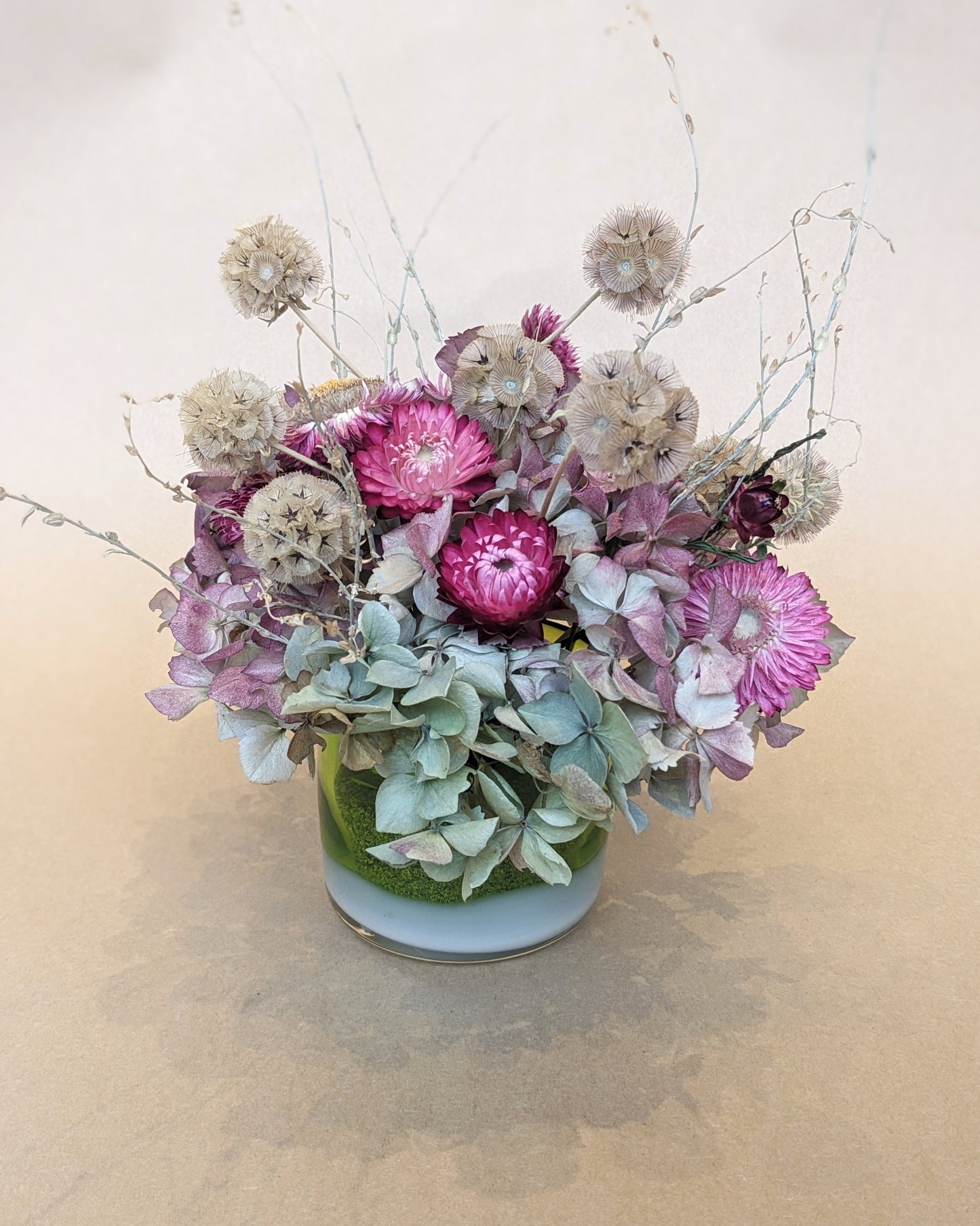 Dried Floral Arrangement in a Blown Glass Votive